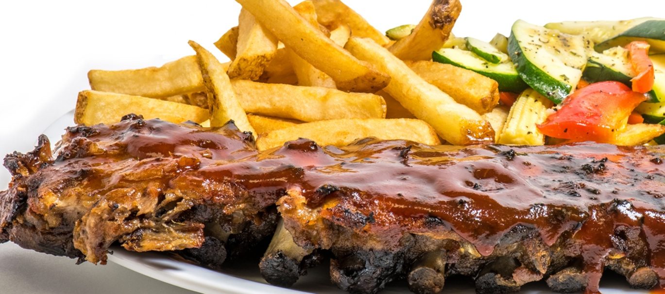 BBQ ribs with fries and grilled vegetables